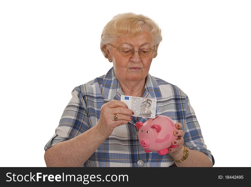 Eldery woman with piggy bank saving money - isolated on white background