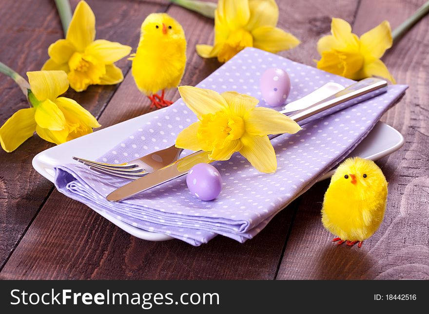 Easter table setting with flowers and biddy