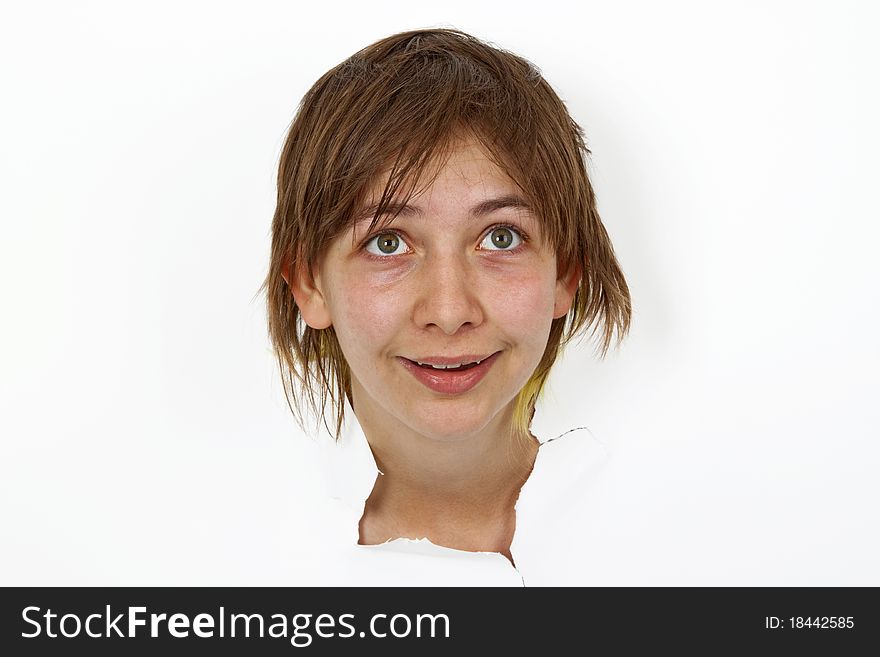 Young Woman is looking out of cutted paper.