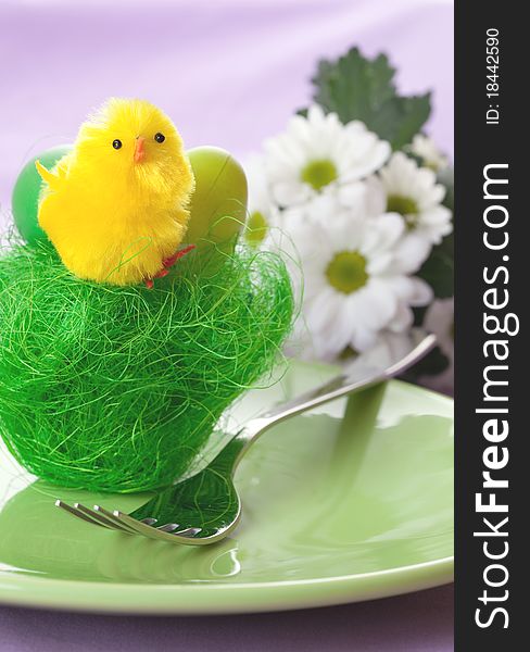 Table setting with yellow biddy in a basket. Table setting with yellow biddy in a basket