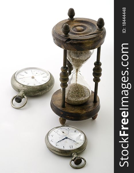 Clocks with an old hourglass. Clocks with an old hourglass