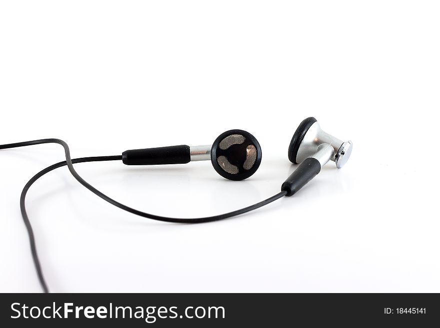 A pair of black headphones isolated against a white background