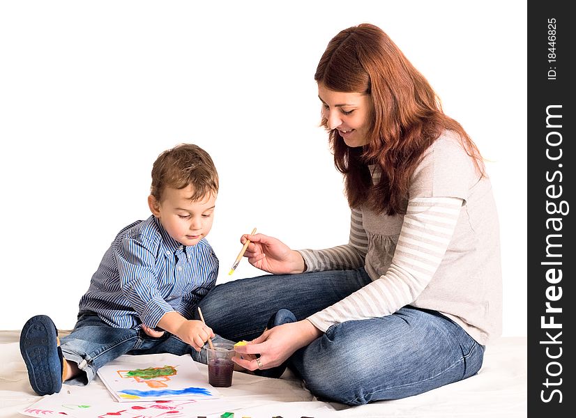 Young mother and a 3 years old son painting