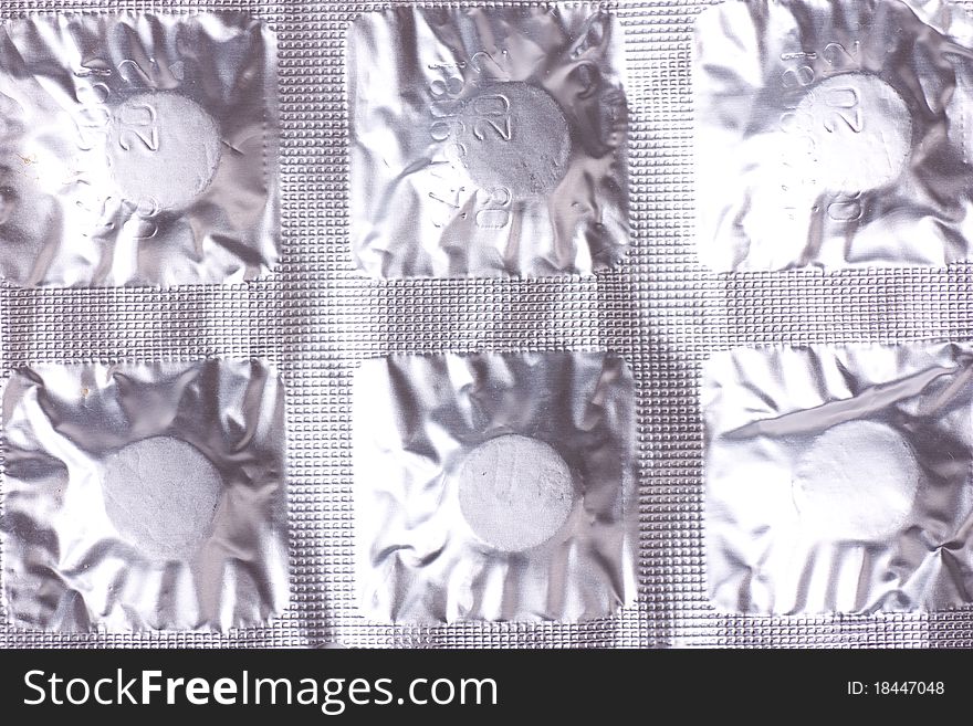 Closeup view of pills pack. Relief foil packing