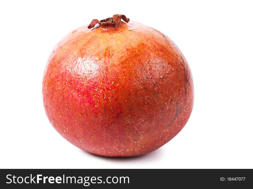 Ripe pomegranate isolated over white background