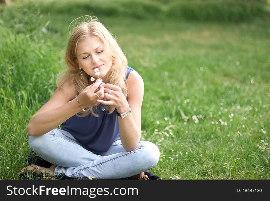 Pretty Girl With Flowers In Her Hair Outdoors