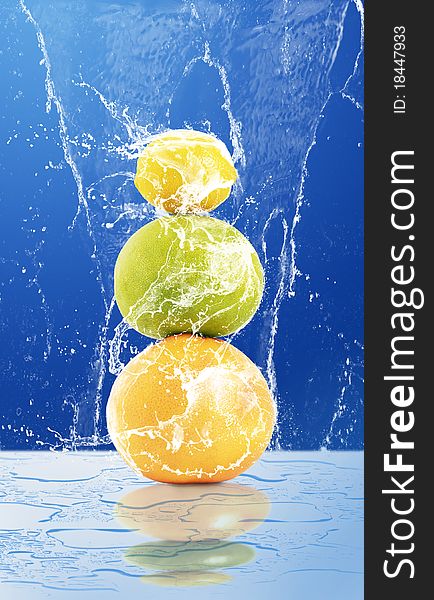 Fruit in water on a blue background