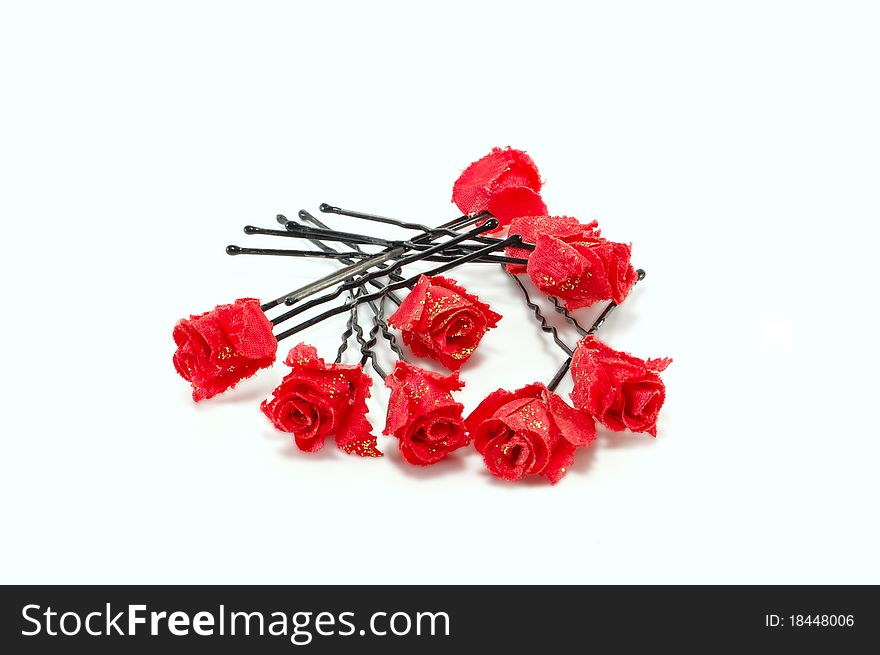 Hairpins for hair with roses are isolated on a white background. Hairpins for hair with roses are isolated on a white background