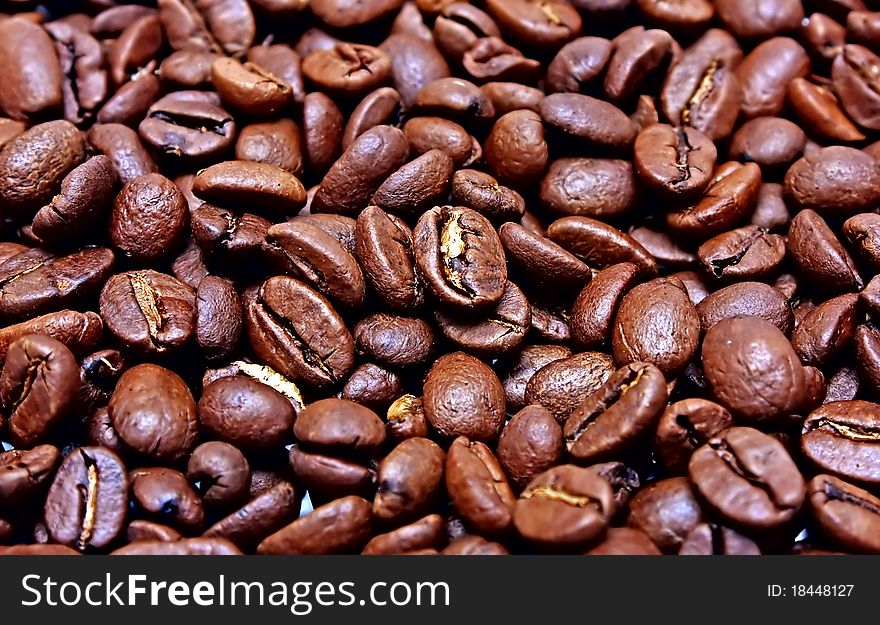 Fragrant fried coffee beans. Food background