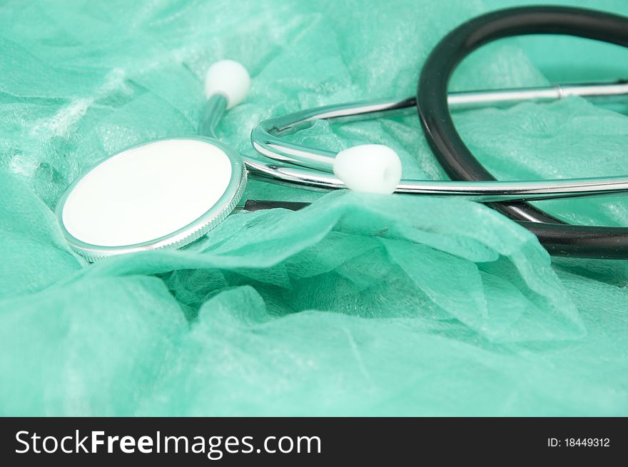 Stethoscope on a green sterile material