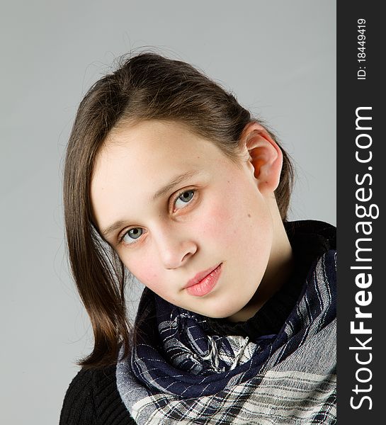 Young cute Teen, on gray background