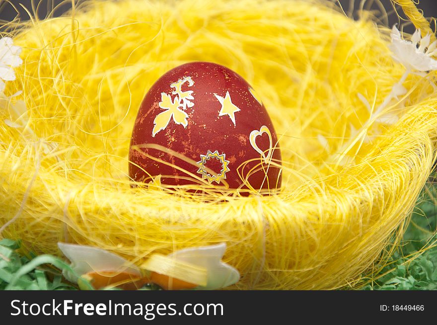 Red Easter egg in the basket