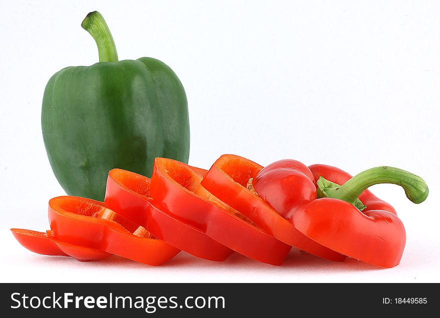 Red and green bell peppers that are isolated. Red and green bell peppers that are isolated.