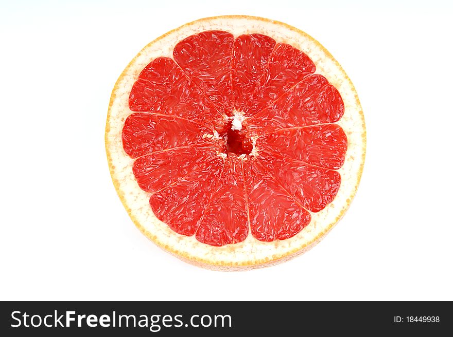 Ripe red grapefruit. Slice fruit on white background