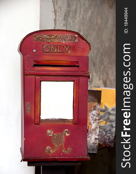 Old red thai mailbox with text \\\only\\\