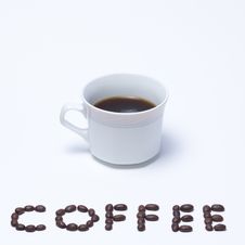 Coffee Cup With Coffee Beans Stock Photos