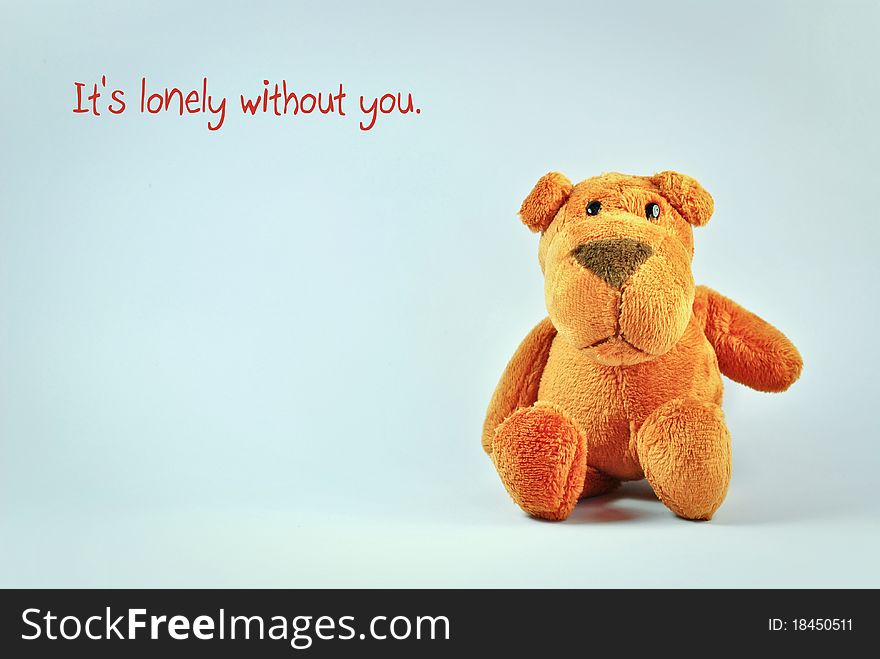 Dog stuffed toy with It's lonely without you message. Note: Message can be edited.