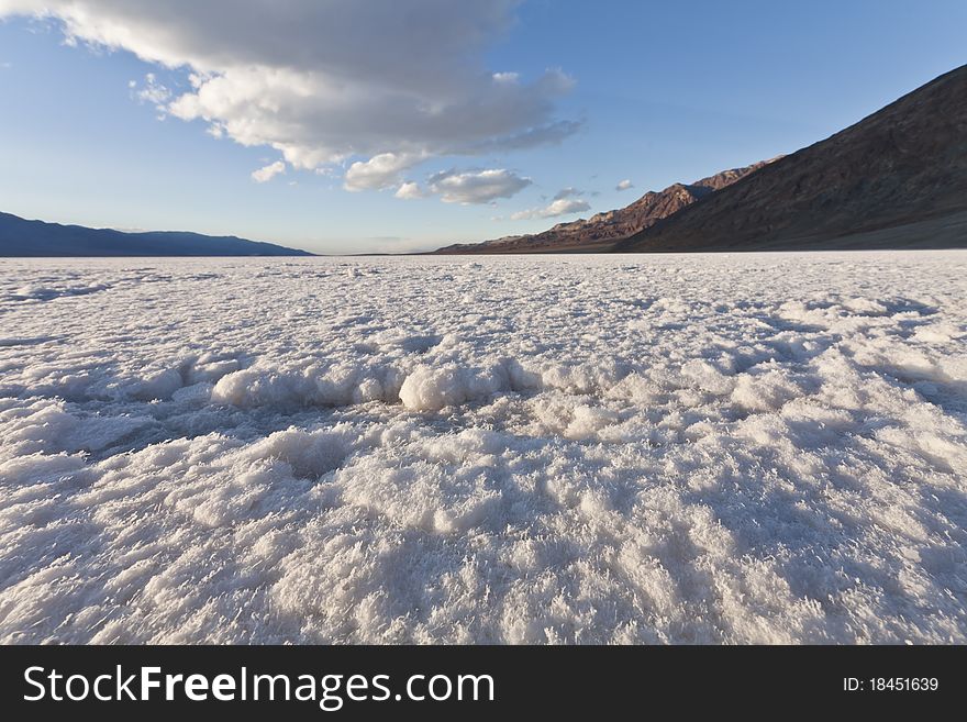 Low angle shot of the badwater salt basin in death valley national park. Low angle shot of the badwater salt basin in death valley national park