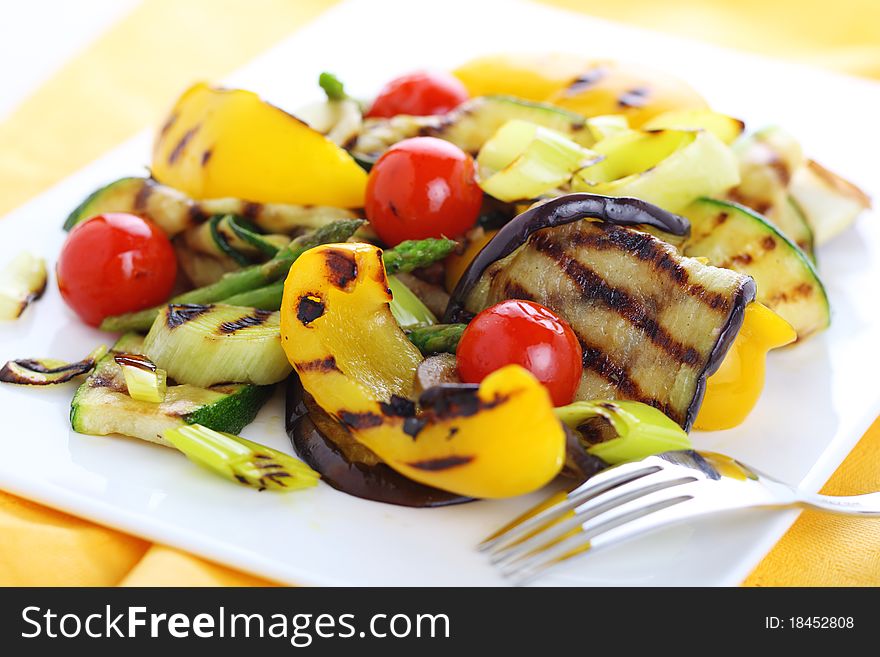 Grilled vegetables on white plate