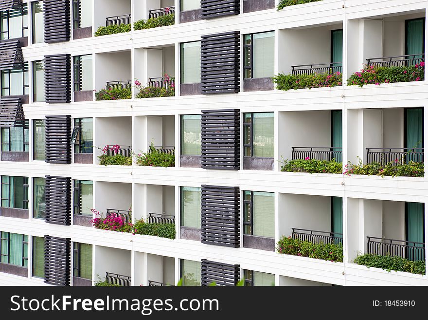 Apartment balcony and windows with flowers