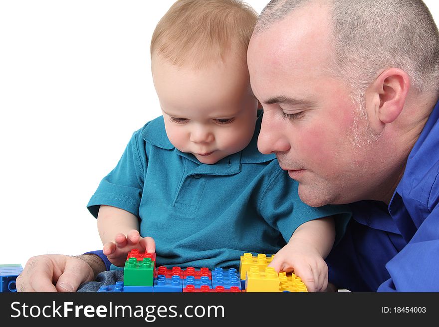 Father and son building with colorful blocks. Father and son building with colorful blocks