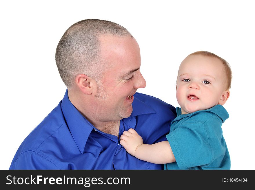 Father and son in blue shirts against white background