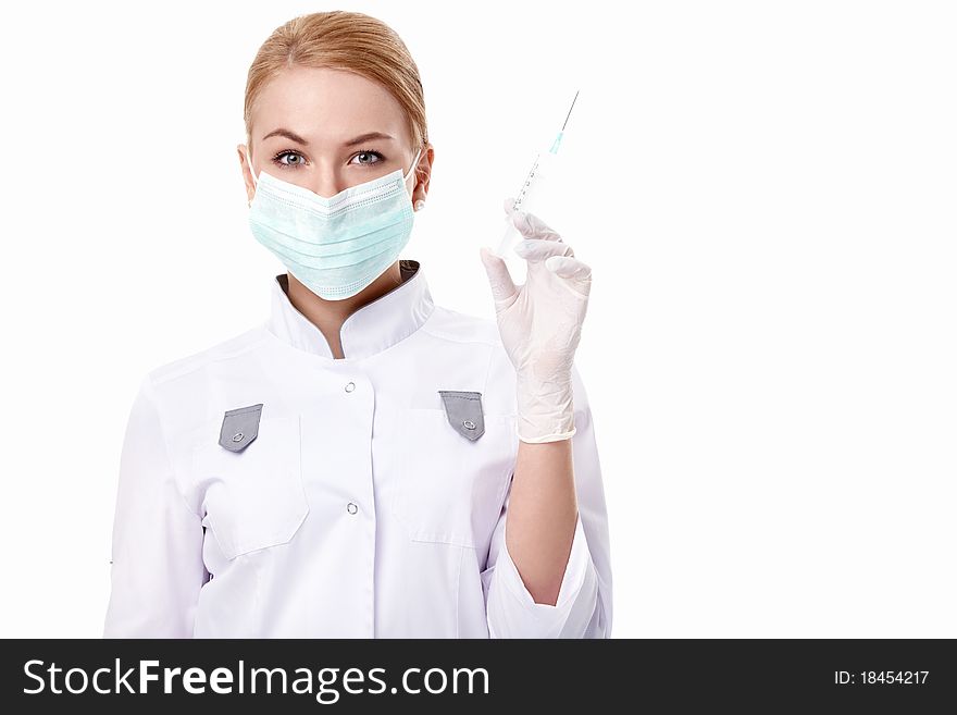 A young doctor with a syringe on white background. A young doctor with a syringe on white background