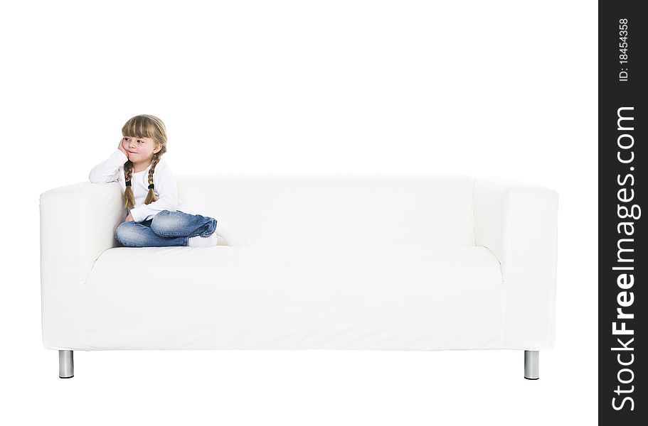 Young girl in a sofa isolated on white background