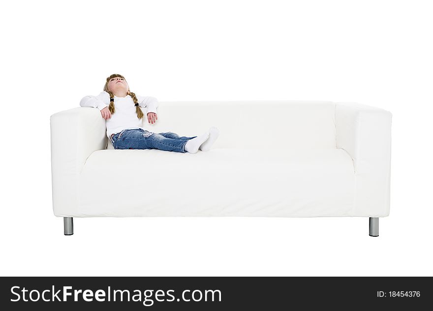 Young girl in a sofa isolated on white background