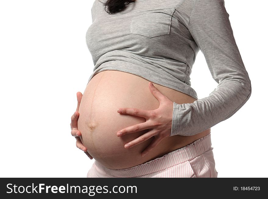 Pregnant young woman in studio. Pregnant young woman in studio