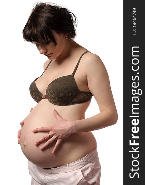 Pregnant woman in bra look to their stomach