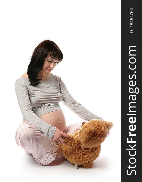 Pregnant young woman in studio. Pregnant young woman in studio