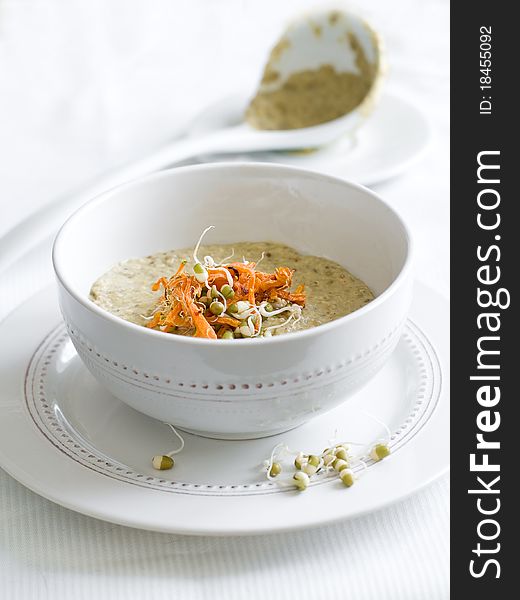 Vegetarian cream soup with vegetable, decorated with pies and carrot