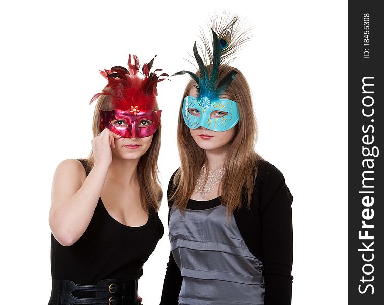 Two girl in the masquerade mask on a white background