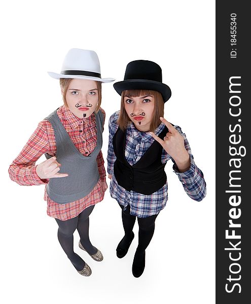 Two girls with painted mustaches and bowler hats on white background