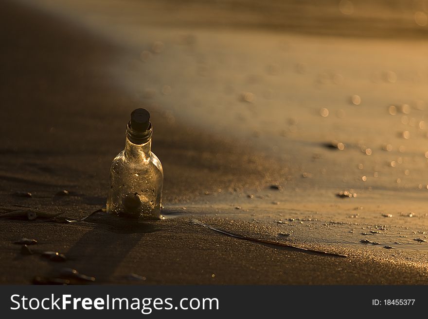 A message in the bottle on sand