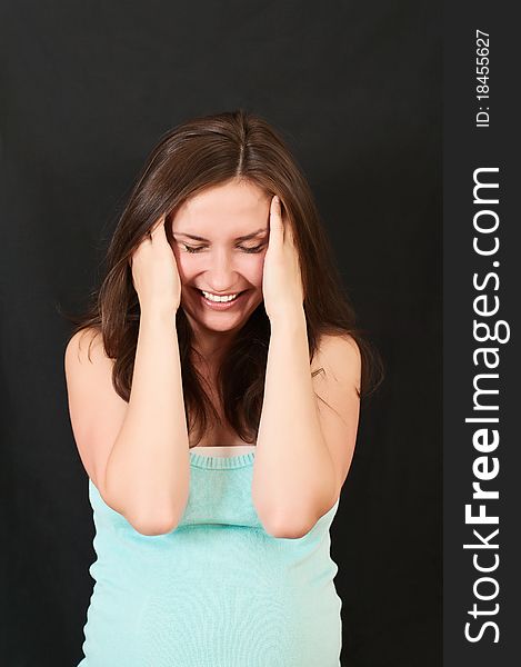 Portrait of a beautiful young girl on a black background. Portrait of a beautiful young girl on a black background