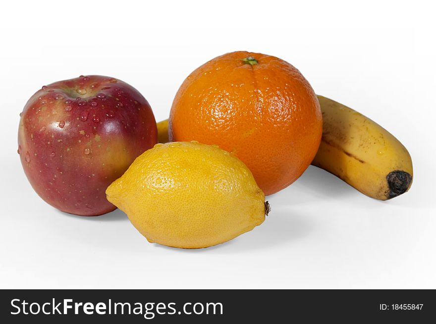 Pieces of fresh fruit on white bottom. Pieces of fresh fruit on white bottom