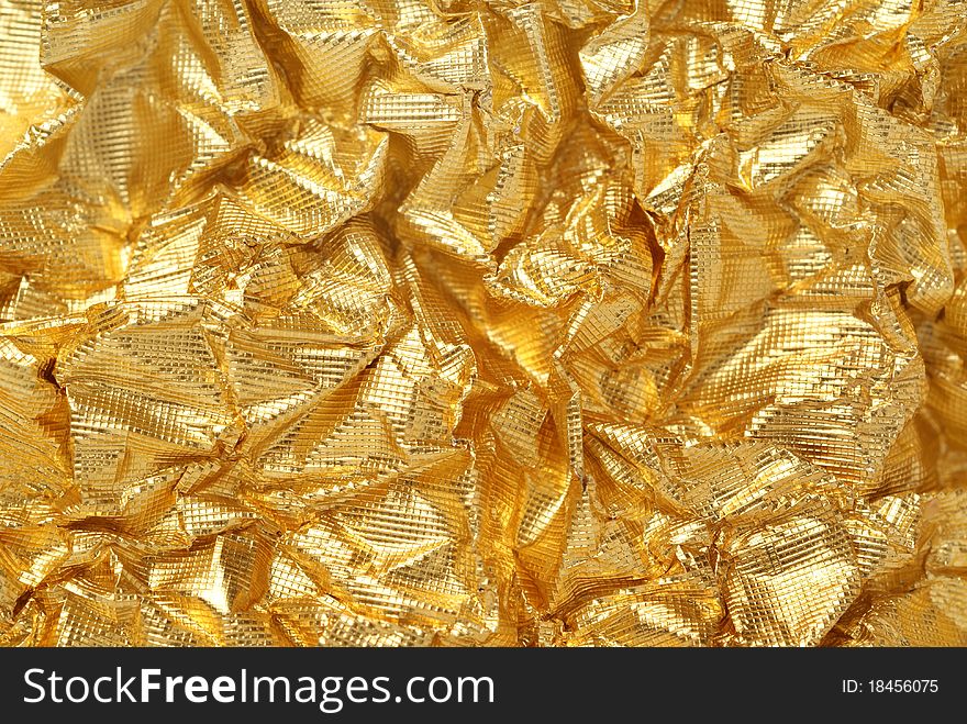 Artistic background from golden foil