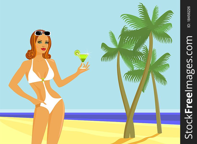 Girl with a cocktail on the beach