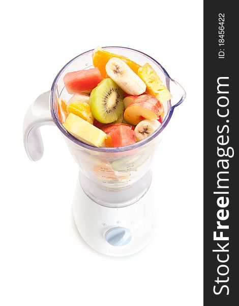Mixed fruit in mixer with white background. Mixed fruit in mixer with white background