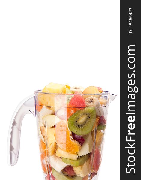 Mixed fruit in mixer with white background. Mixed fruit in mixer with white background