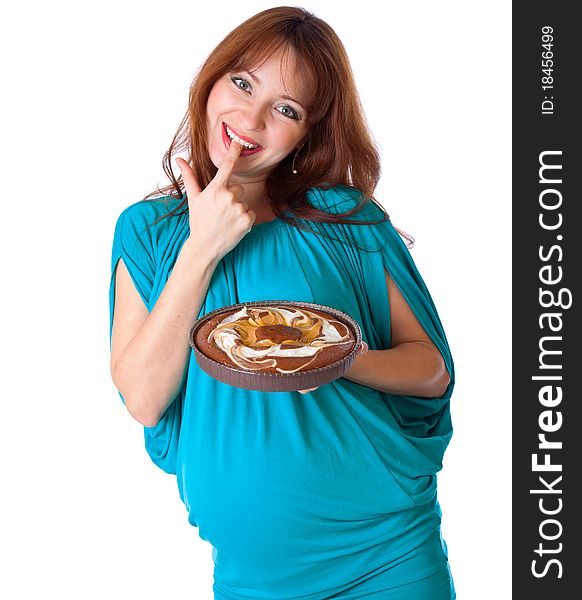 A smiling woman is tasting the cake. isolated on a white background