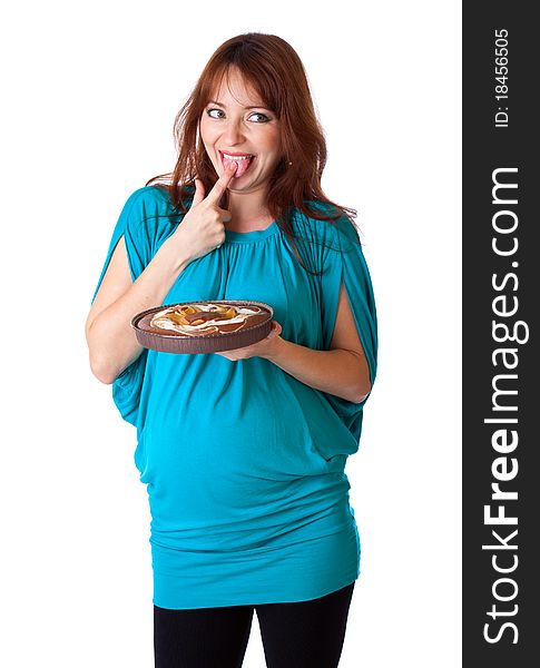 A smiling woman is tasting the cake. isolated on a white background