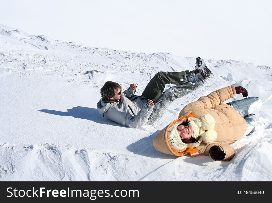 Young couple having fun jumping in the snow. Young couple having fun jumping in the snow