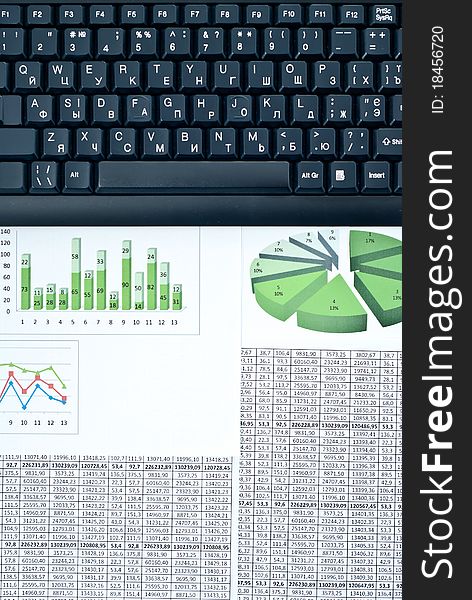 Black keyboard on a stock chart and numbers. Black keyboard on a stock chart and numbers