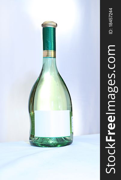 Wine with an empty label on a light background