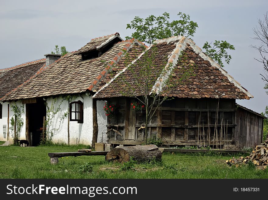 Serbian traditional farm house at sunny summer day. Serbian traditional farm house at sunny summer day.