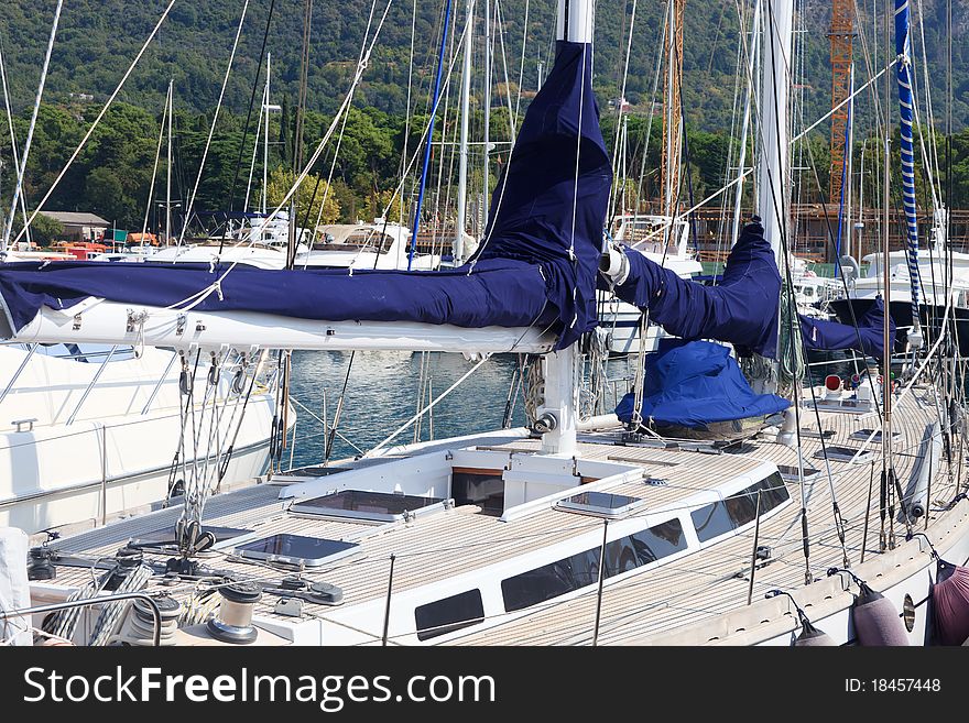 Teak deck and blue sails on a luxury yacht. Teak deck and blue sails on a luxury yacht