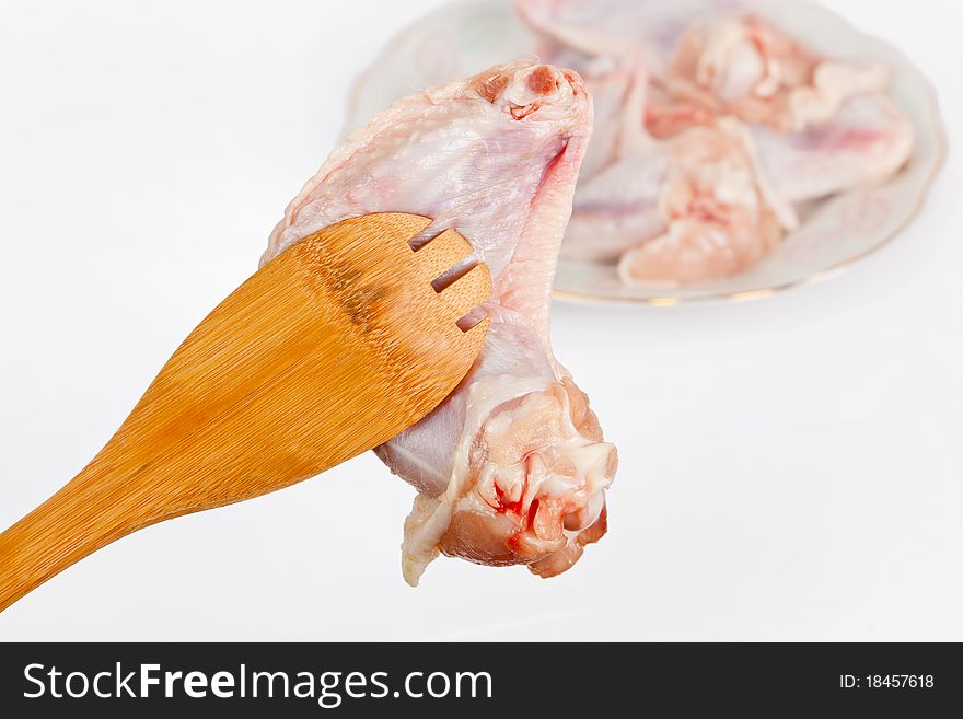 Fresh chicken wings on white background